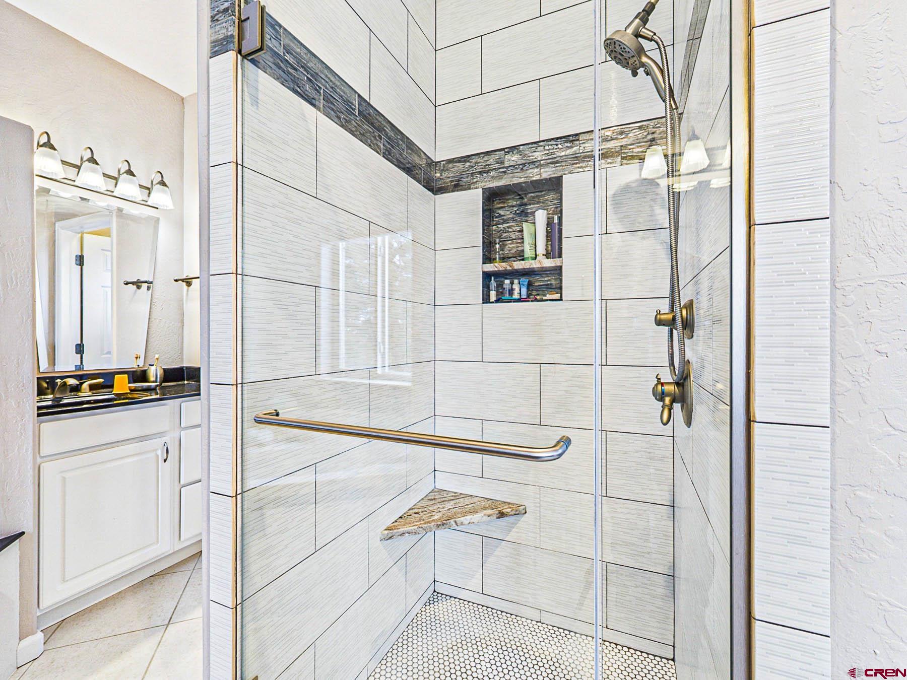 12689 6100th Road Montrose, CO 81403 - Photo 24 of 45 a view of a bathroom with a tub and shower