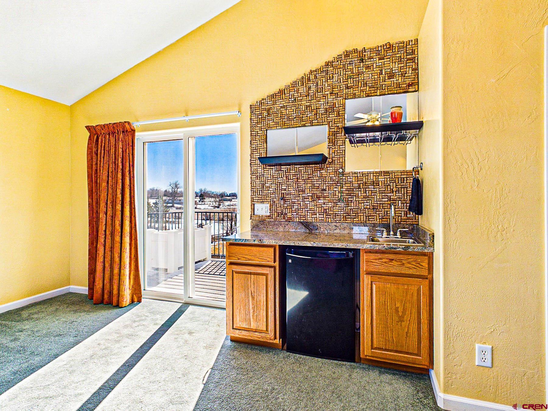12689 6100th Road Montrose, CO 81403 - Photo 30 of 45 a spacious bathroom with a granite countertop sink and a mirror