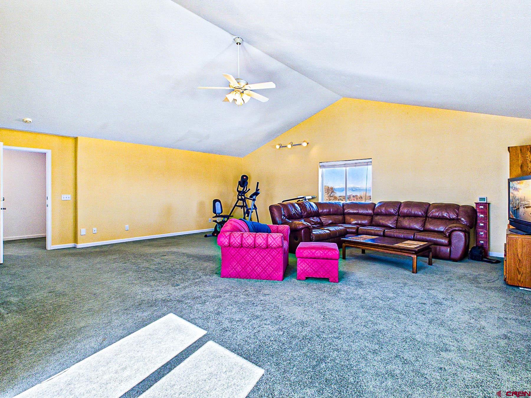 12689 6100th Road Montrose, CO 81403 - Photo 31 of 45 a bedroom with furniture and a large window