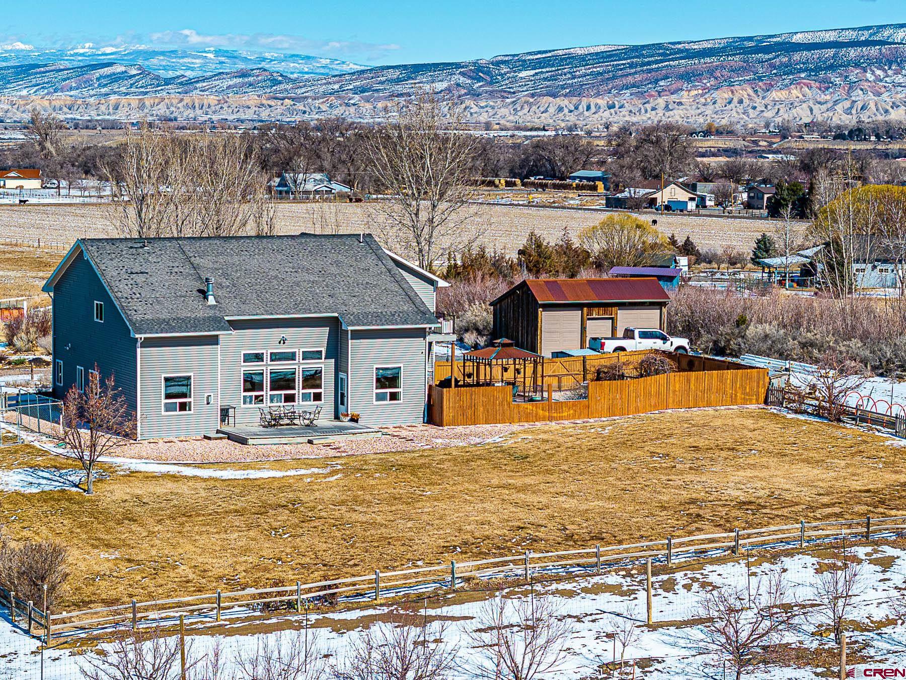 12689 6100th Road Montrose, CO 81403 - Photo 33 of 45 a view of a swimming pool with an ocean view