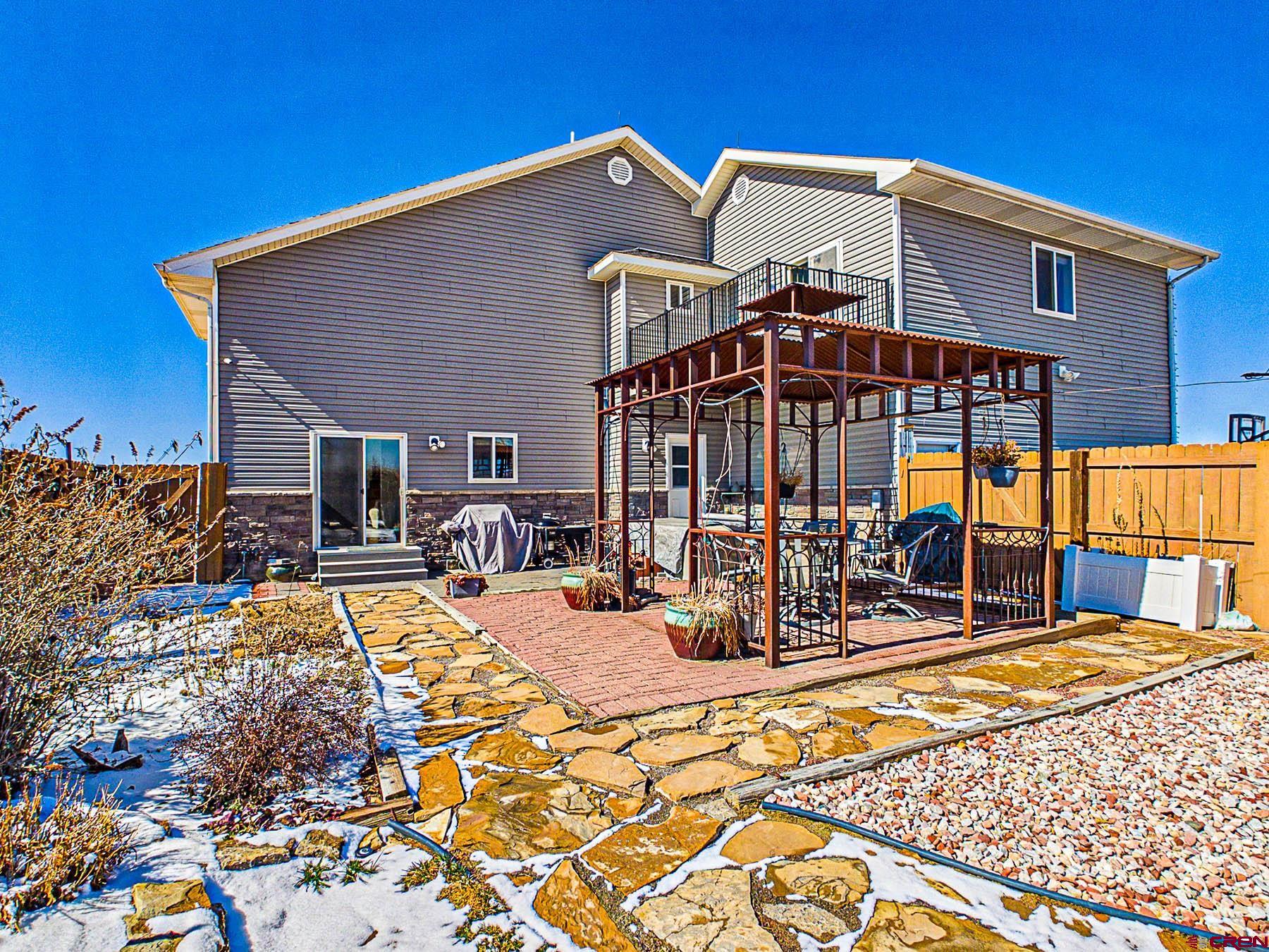 12689 6100th Road Montrose, CO 81403 - Photo 36 of 45 a front view of a house with a patio
