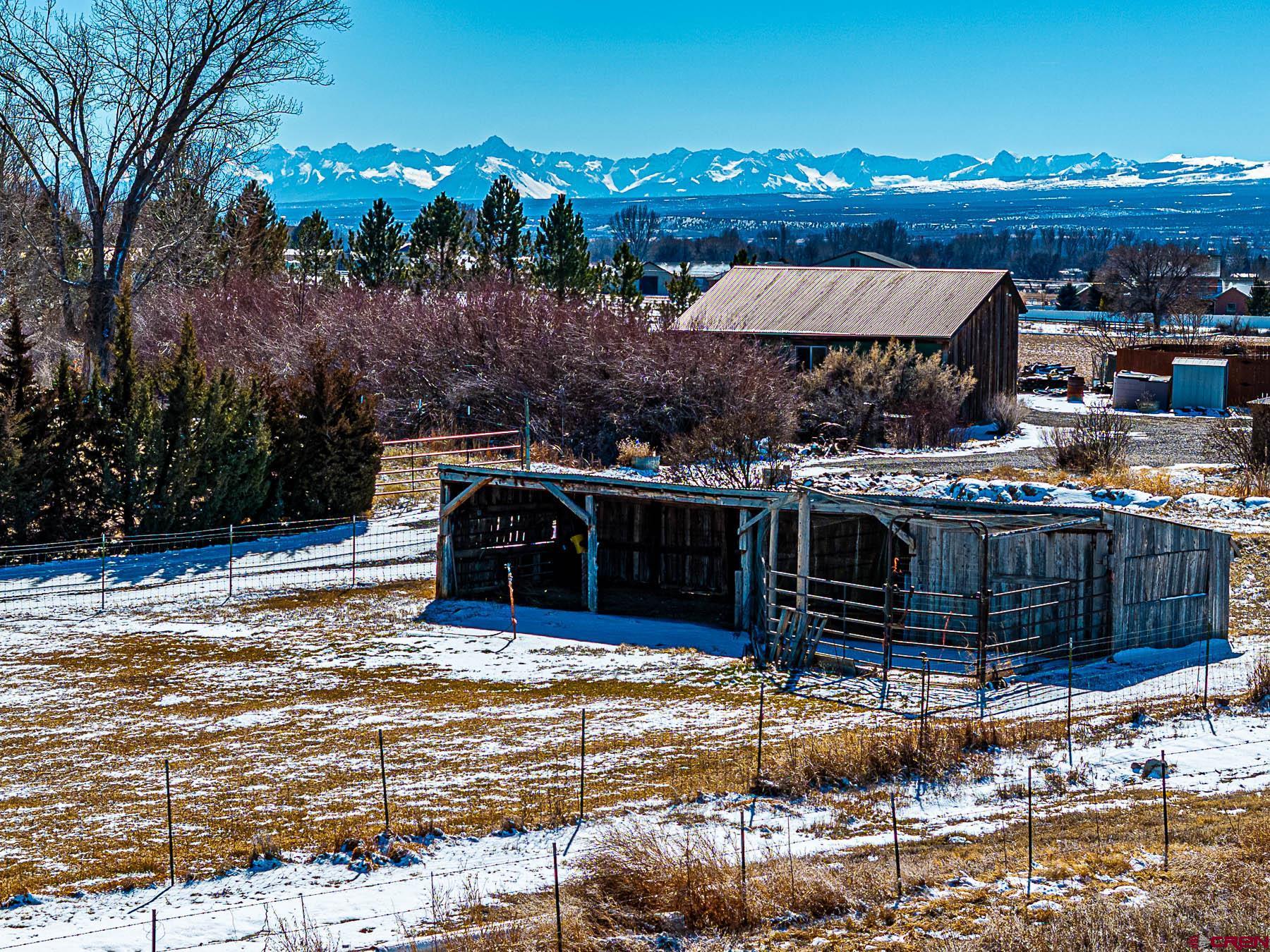 12689 6100th Road Montrose, CO 81403 - Photo 39 of 45 a view of a house with backyard and sitting area