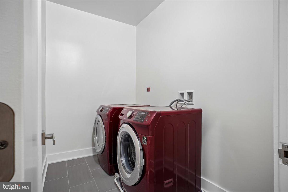 329 16th Street Southeast, Unit 1 Washington, DC 20003 - Photo 13 of 17 Modern laundry space with vibrant appliances.