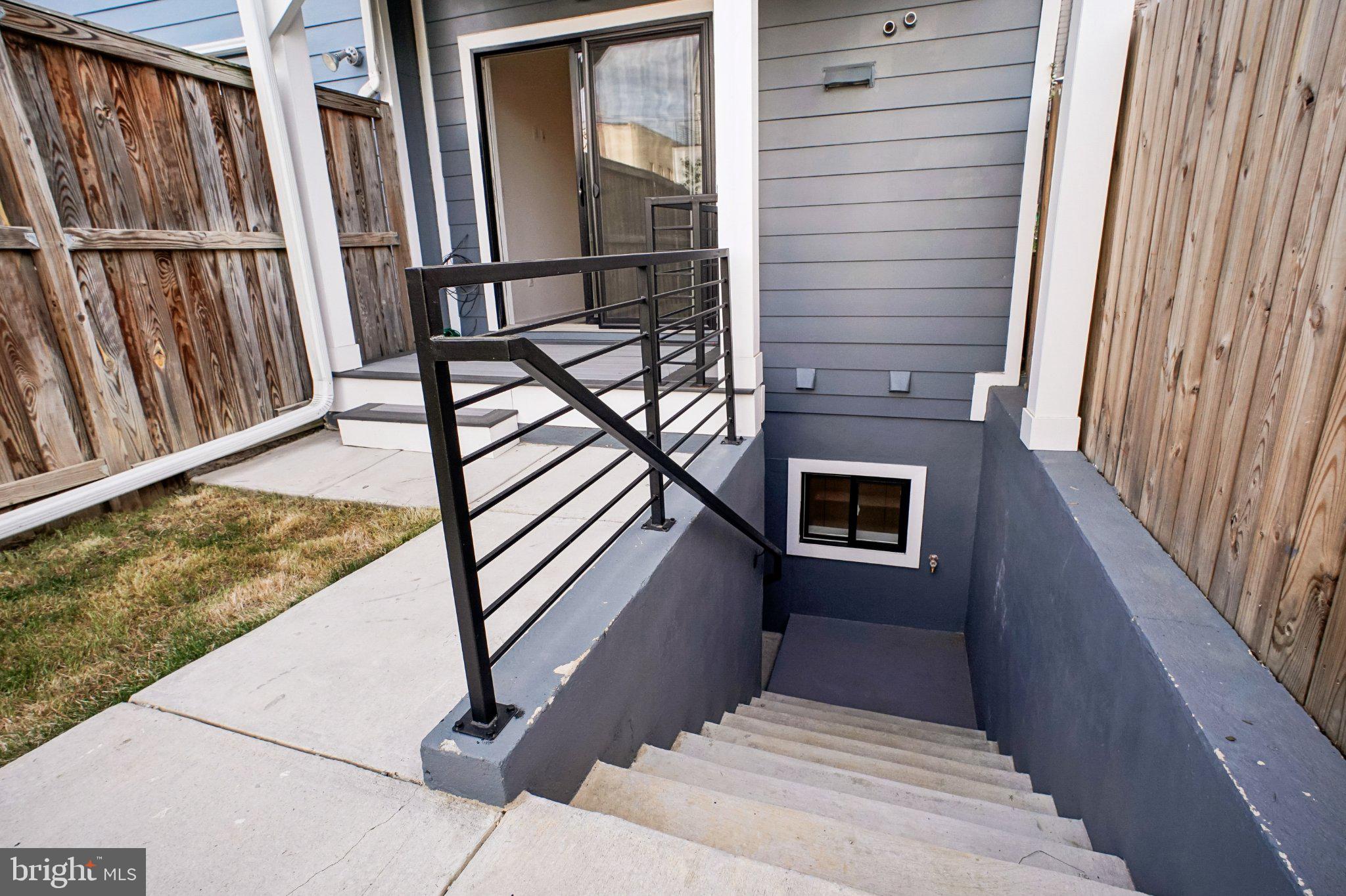 329 16th Street Southeast, Unit 1 Washington, DC 20003 - Photo 14 of 17 Stylish entryway with modern stairs.