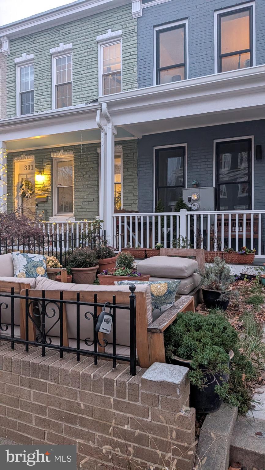 329 16th Street Southeast, Unit 1 Washington, DC 20003 - Photo 2 of 22 a backyard of a house with outdoor seating