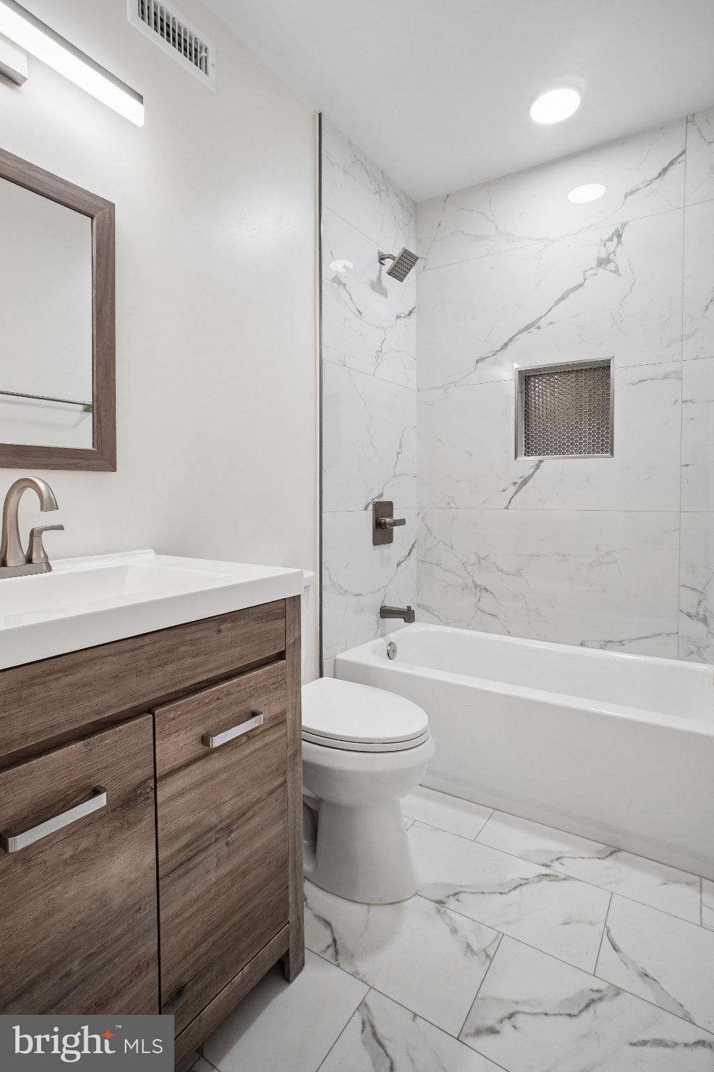 329 16th Street Southeast, Unit 1 Washington, DC 20003 - Photo 9 of 17 Sleek modern bathroom with marble accents.