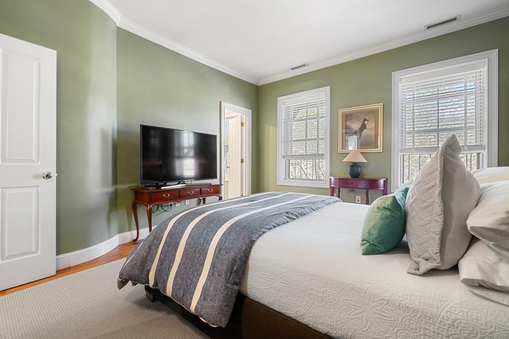 59 Rutland Street, Unit 3 Boston, MA 02118 - Photo 13 of 40 a bedroom with a bed and a flat screen tv
