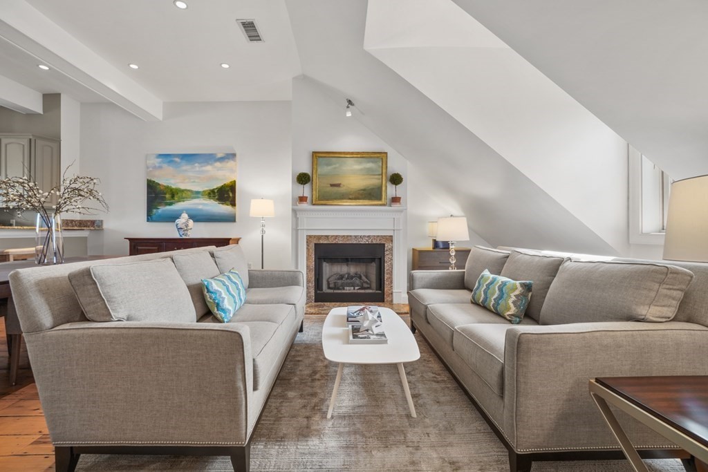 59 Rutland Street, Unit 3 Boston, MA 02118 - Photo 2 of 40 a living room with furniture and a fireplace