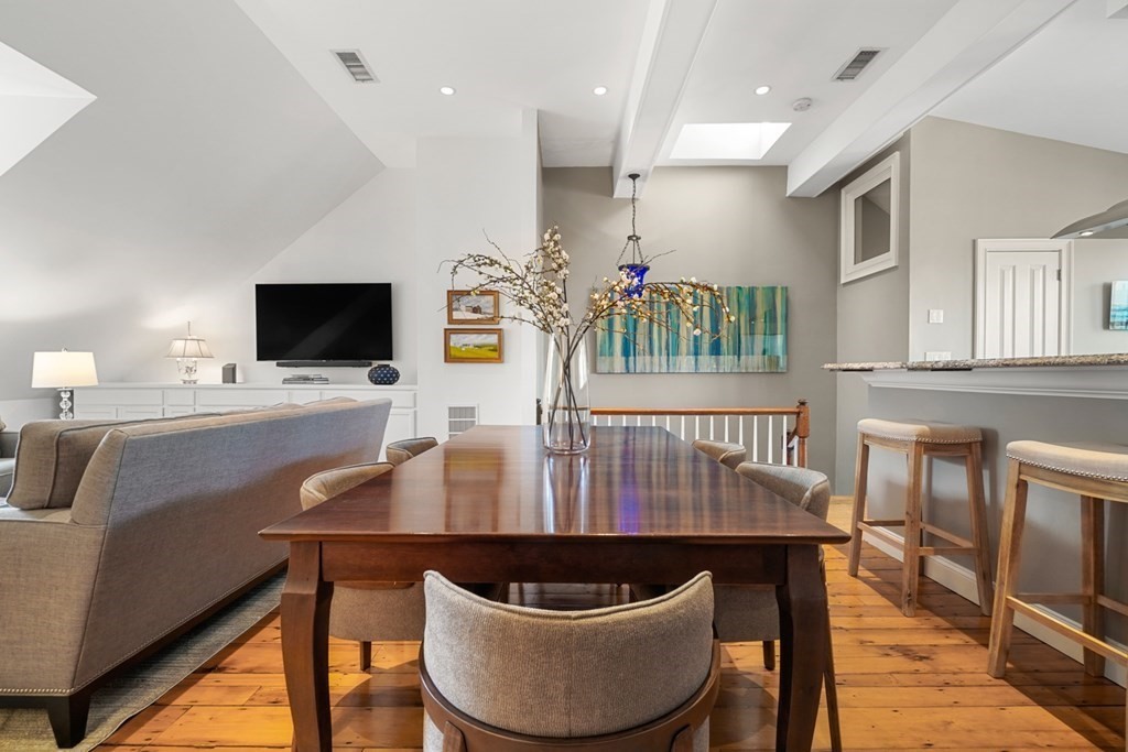 59 Rutland Street, Unit 3 Boston, MA 02118 - Photo 6 of 40 a dining room with furniture a window and a kitchen view