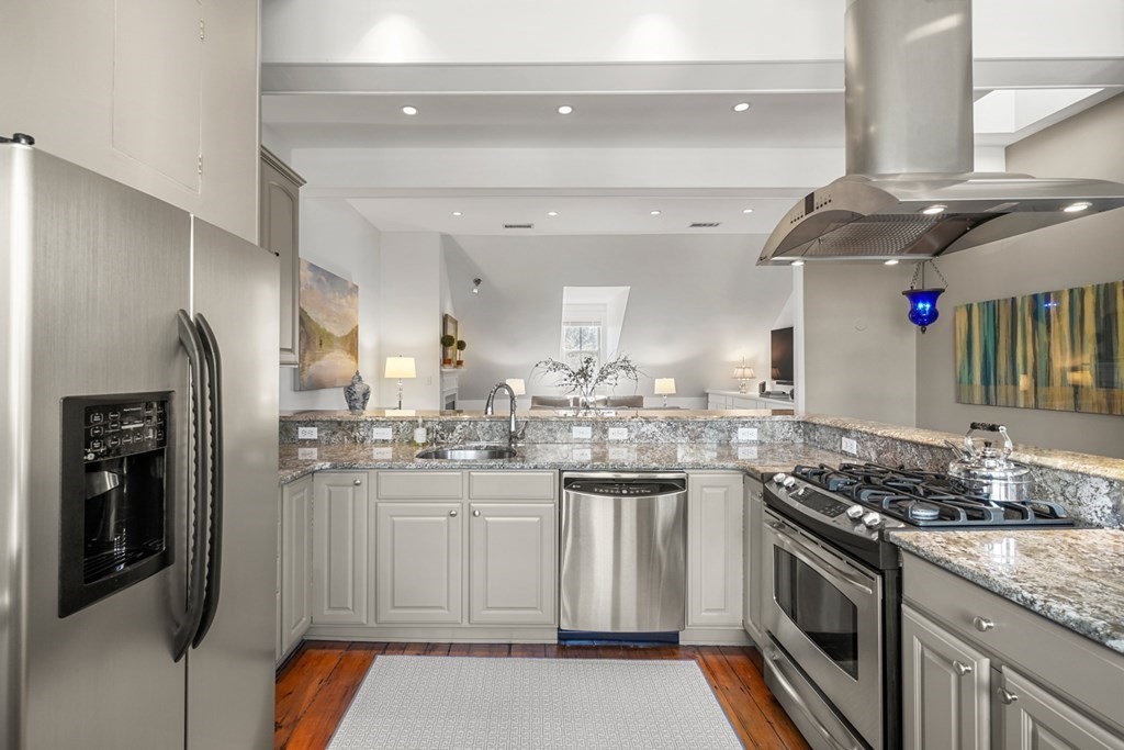 59 Rutland Street, Unit 3 Boston, MA 02118 - Photo 10 of 40 a kitchen with stainless steel appliances granite countertop a sink stove and refrigerator