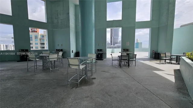 a view of a swimming pool with a bench in front of it