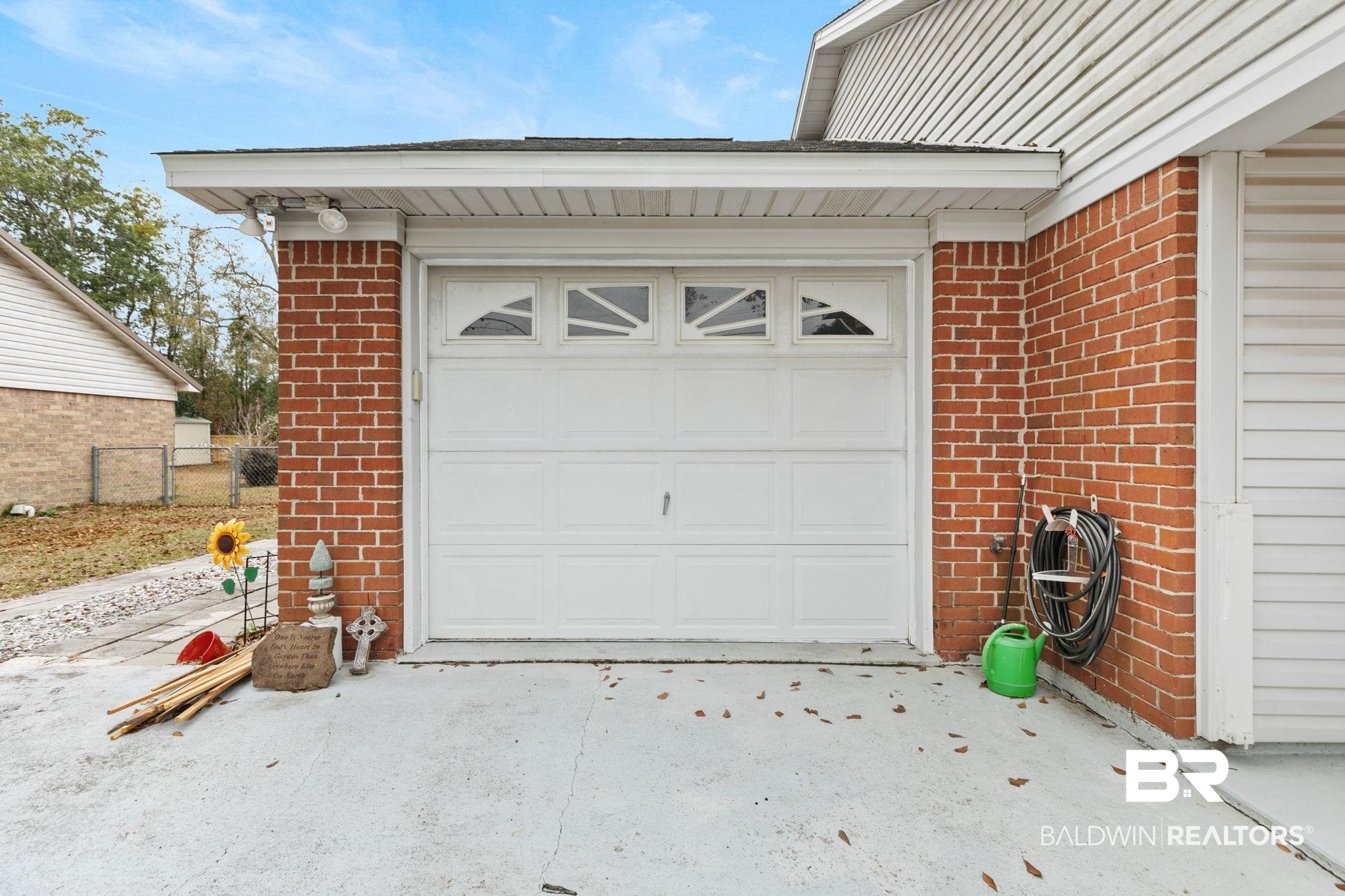 519 Juniper Place Drive Foley, AL 36535 - Photo 28 of 47 Garage featuring concrete driveway