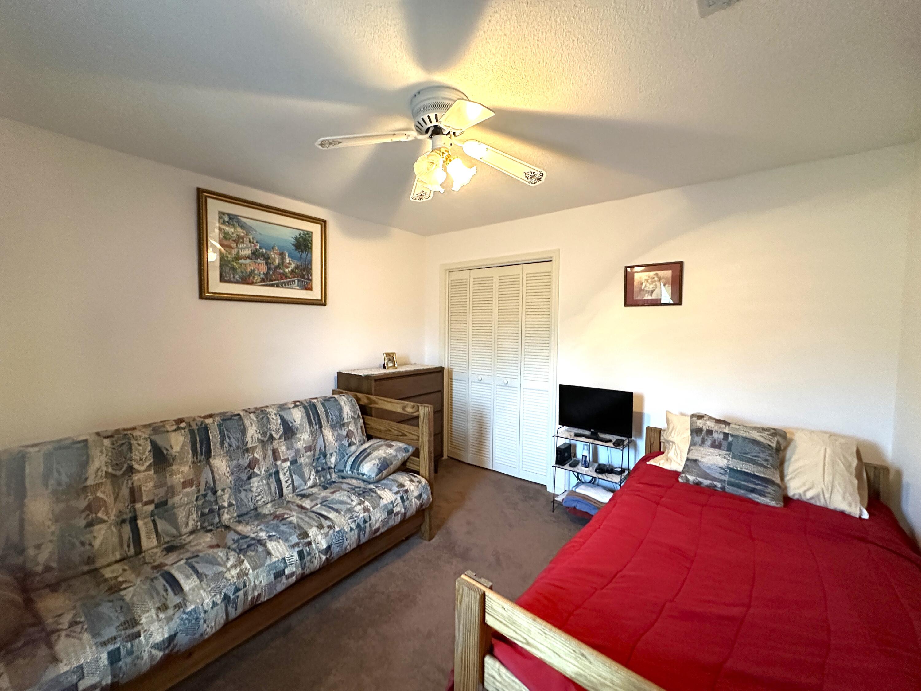 3864 Bear Head Road Crestview, FL 32539 - Photo 17 of 57 a living room with furniture and a flat screen tv
