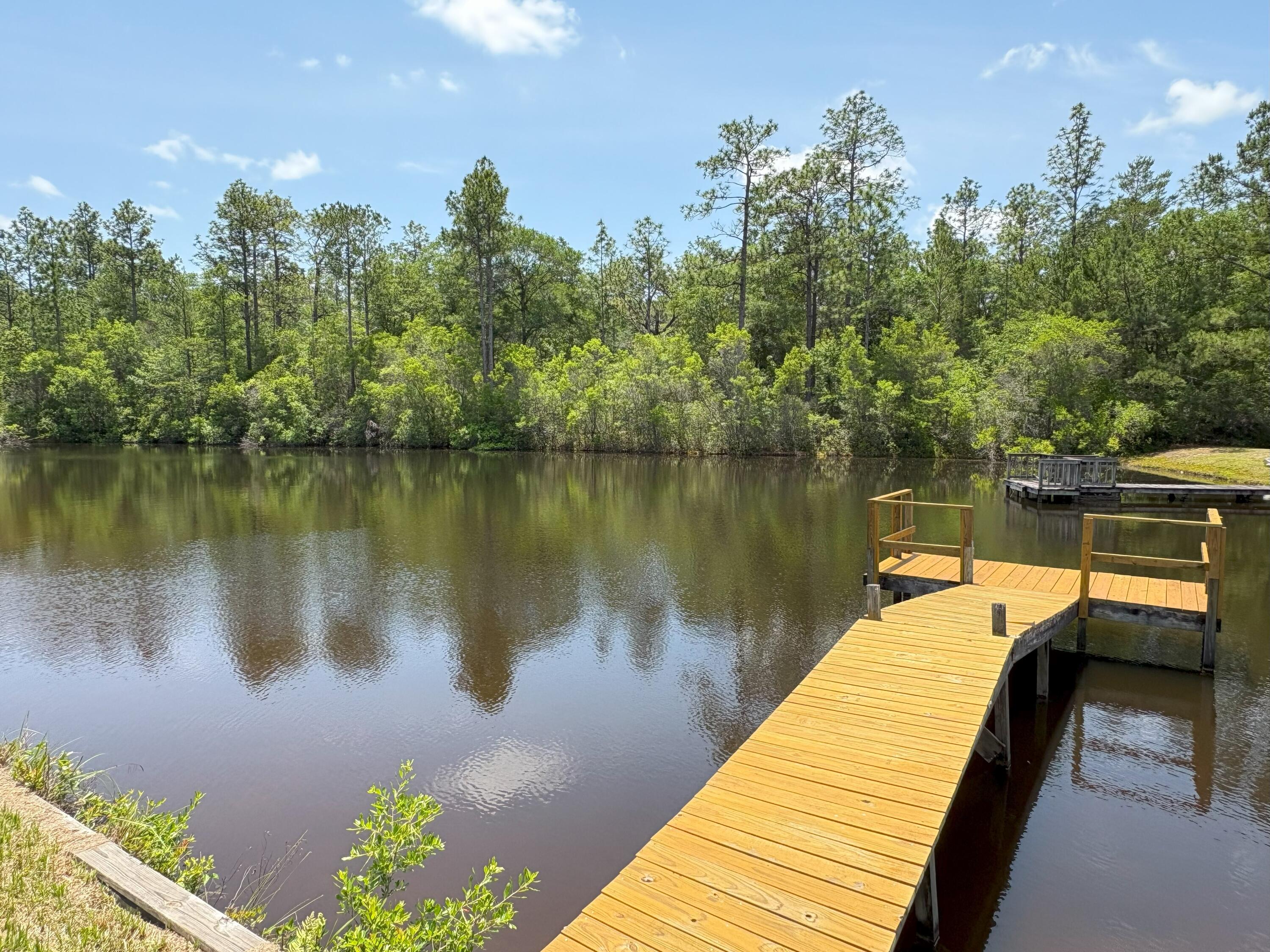 3864 Bear Head Road Crestview, FL 32539 - Photo 22 of 57 a lake view with a lake view
