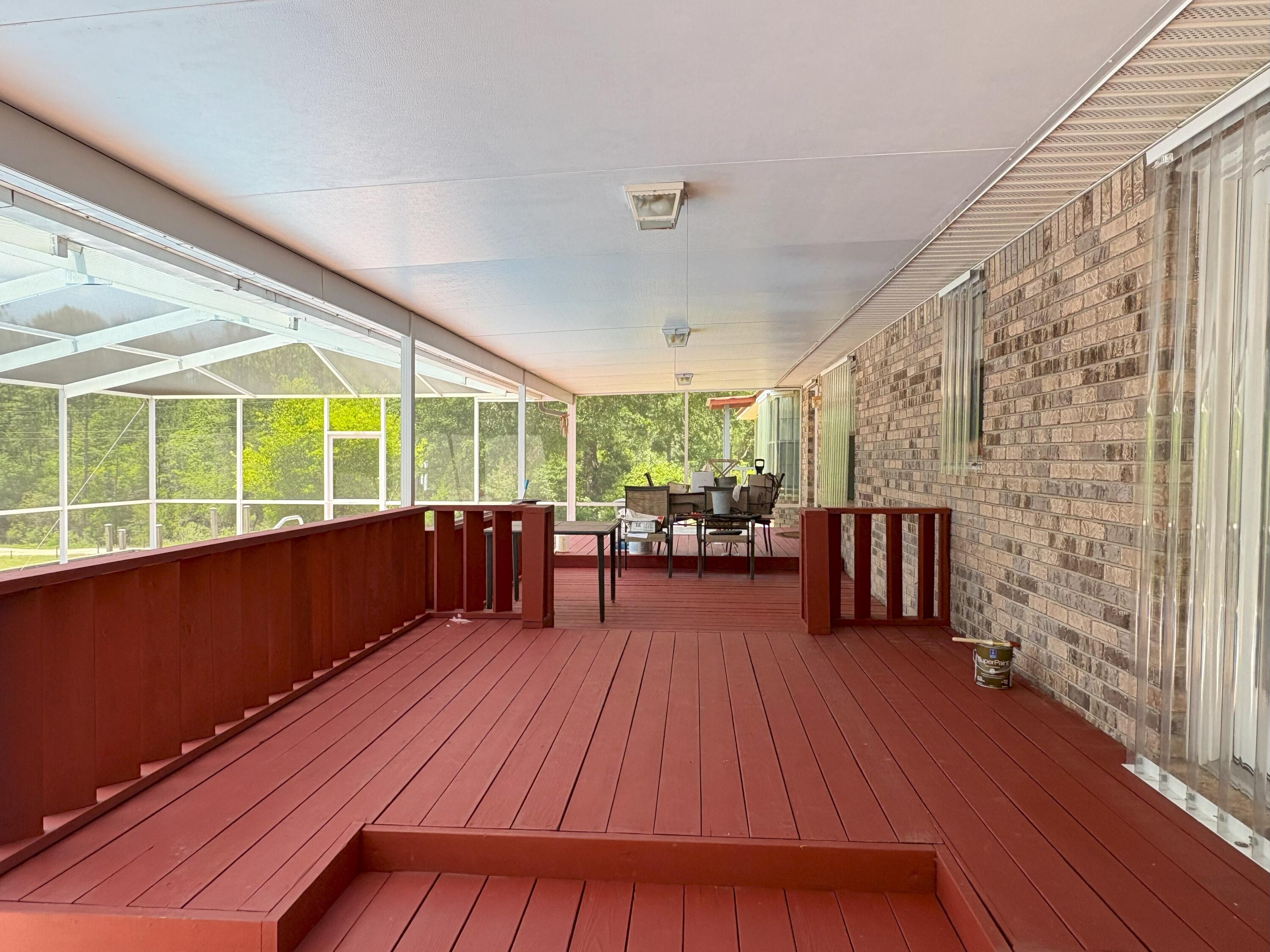3864 Bear Head Road Crestview, FL 32539 - Photo 24 of 57 a view of a room with wooden floor and balcony