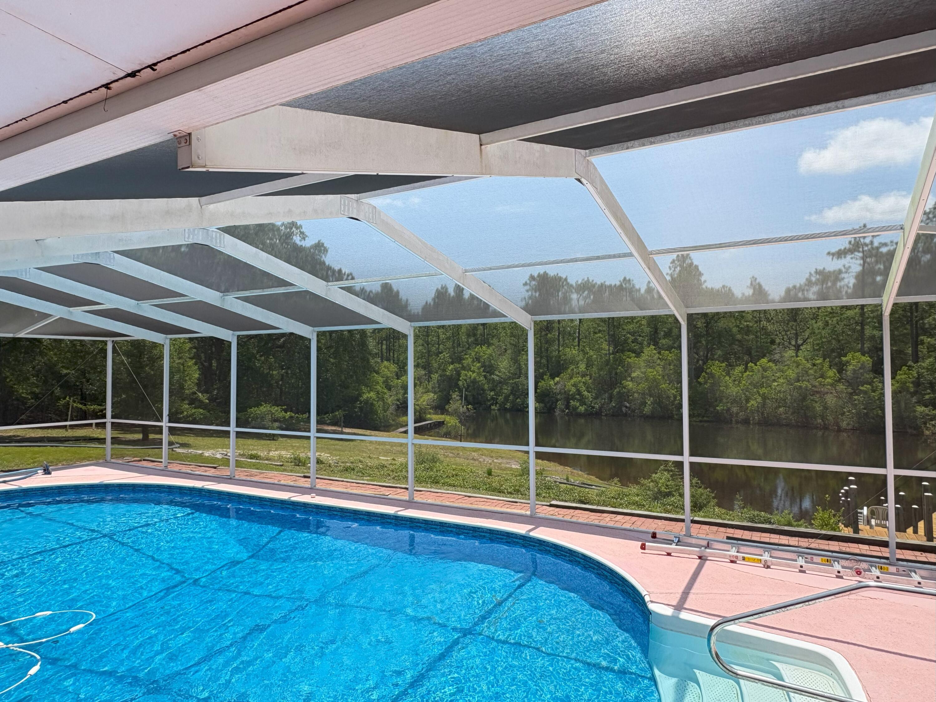 3864 Bear Head Road Crestview, FL 32539 - Photo 28 of 57 a view of outdoor space with swimming pool