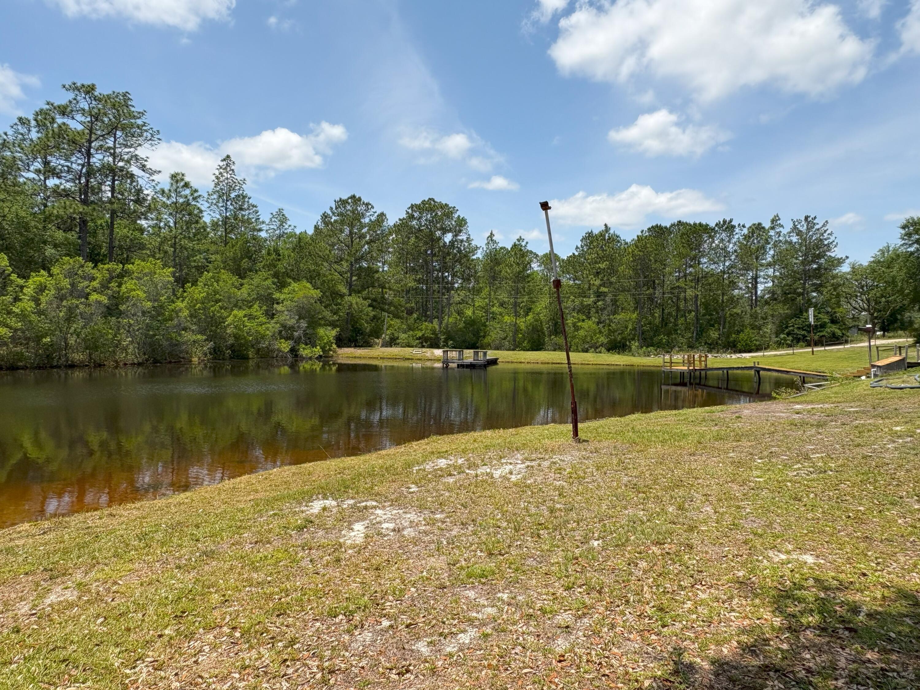 3864 Bear Head Road Crestview, FL 32539 - Photo 40 of 57 a lake view with a lake