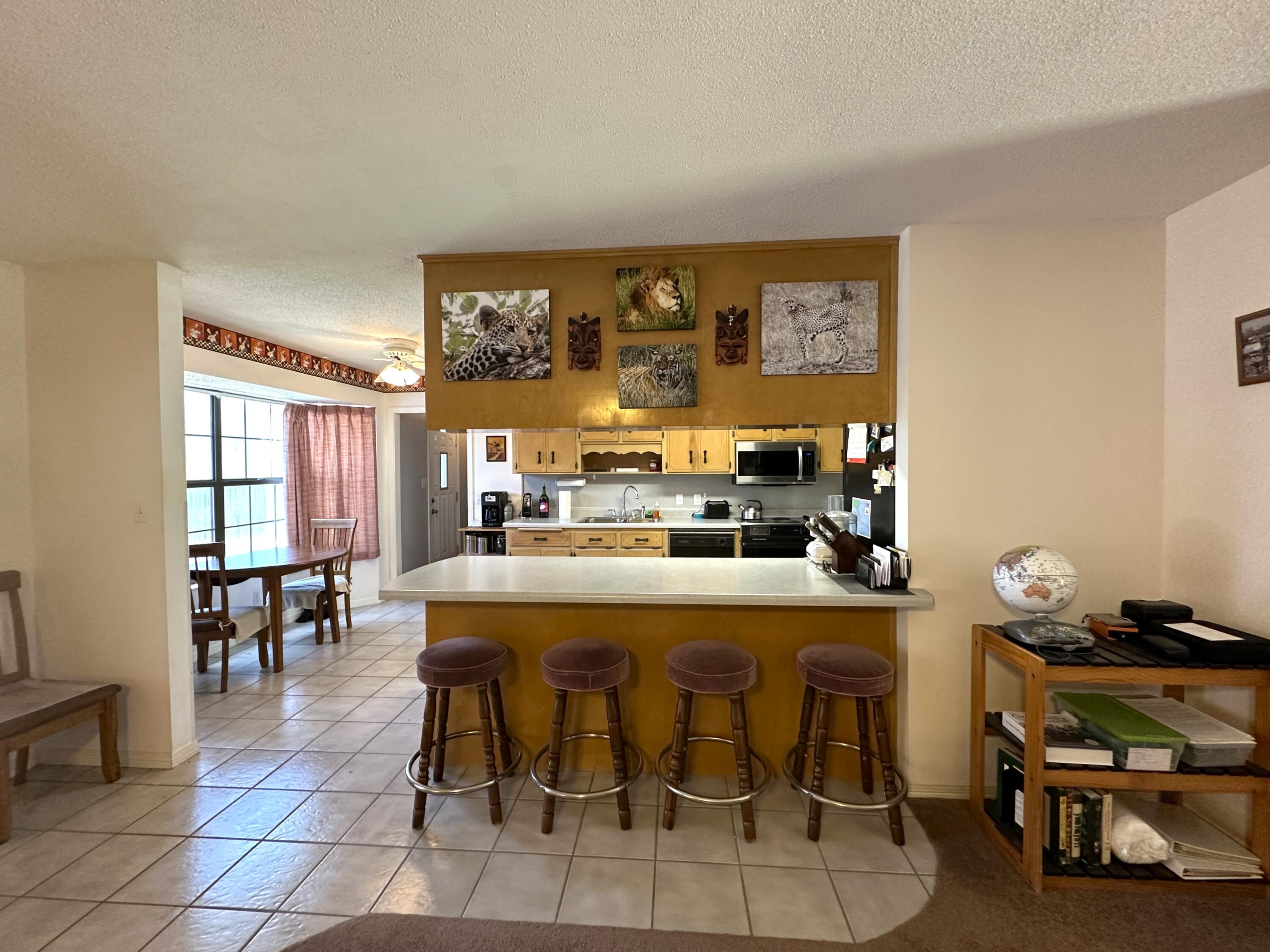 3864 Bear Head Road Crestview, FL 32539 - Photo 7 of 57 a room with stainless steel appliances kitchen island granite countertop furniture and a dining table