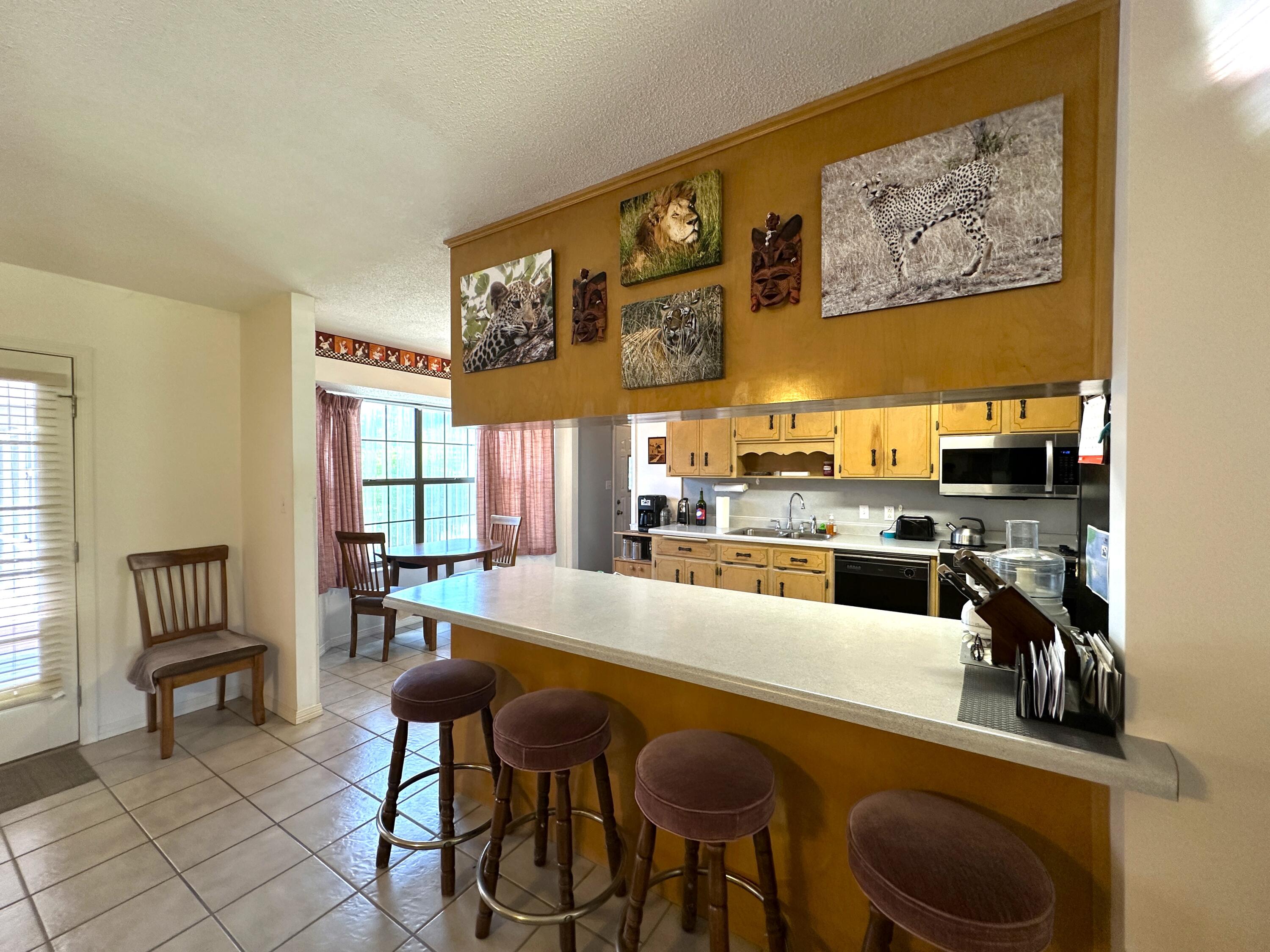 3864 Bear Head Road Crestview, FL 32539 - Photo 8 of 57 a view of a dining room with furniture and chandelier