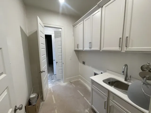 a view of a kitchen with sink and dishwasher