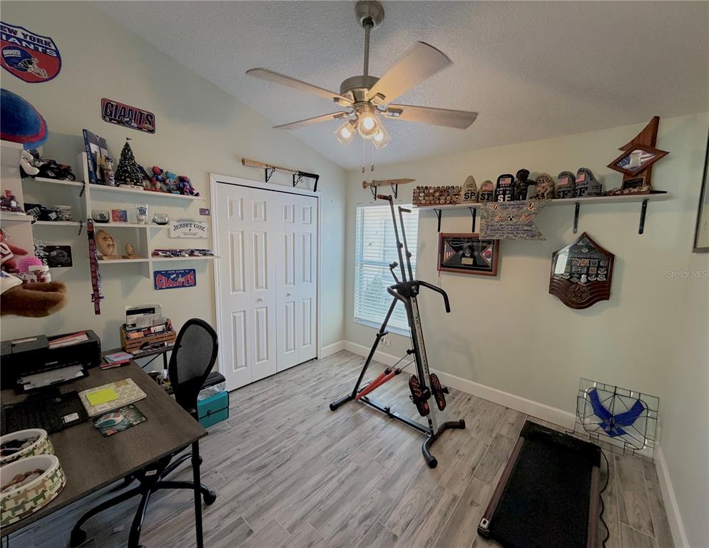 1332 Dew Bloom Road Valrico, FL 33594 - Photo 13 of 22 a view of a room with gym equipment