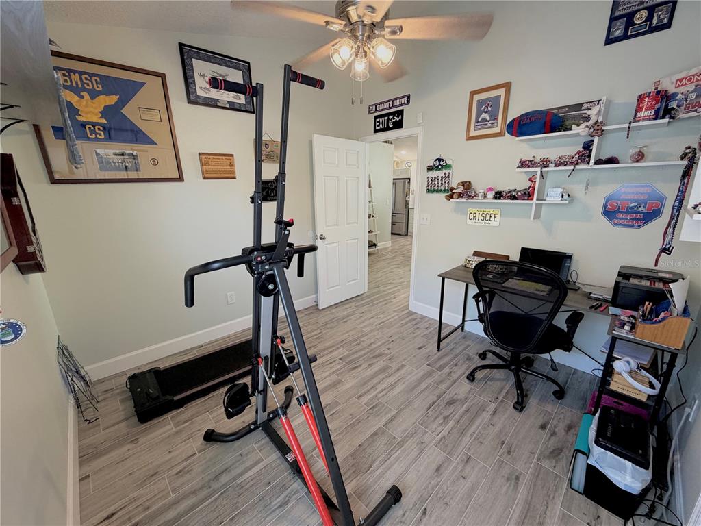 1332 Dew Bloom Road Valrico, FL 33594 - Photo 14 of 22 a view of a workspace with furniture and wooden floor