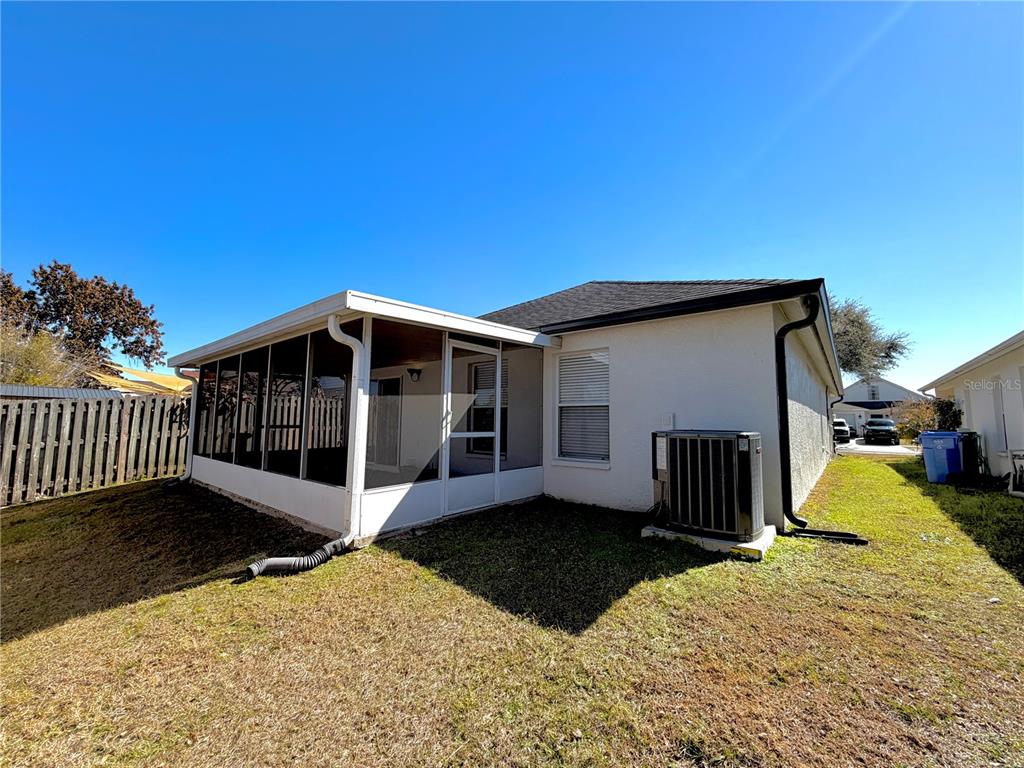 1332 Dew Bloom Road Valrico, FL 33594 - Photo 20 of 22 a view of a house with a yard