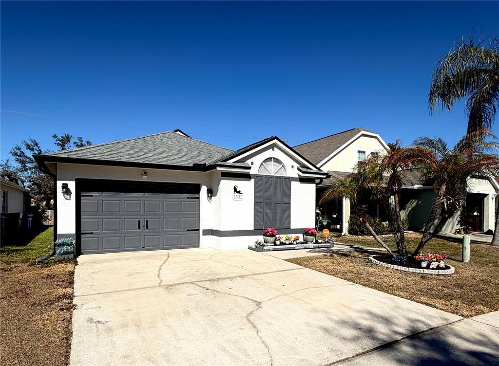 1332 Dew Bloom Road Valrico, FL 33594 - Photo 21 of 22 a view of a house with a yard