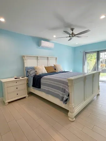 a bedroom with a bed and a dresser