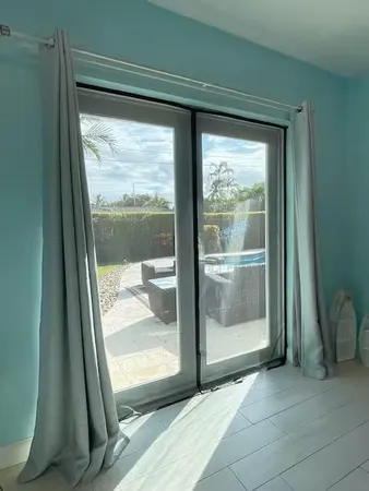 a view of a room with wooden floor and a porch