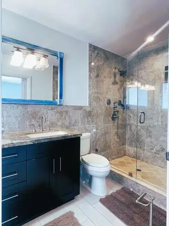 a bathroom with a sink a toilet and bathtub