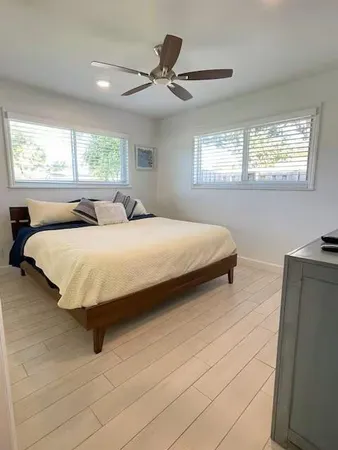a bedroom with a bed and window
