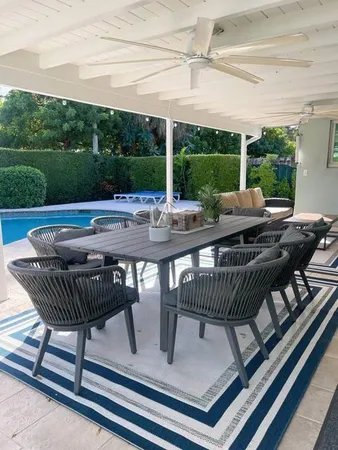a view of a patio with a table chairs and a table