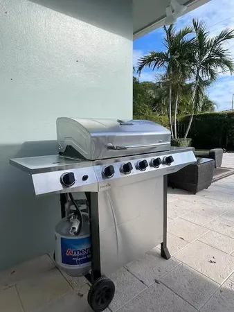 a stove top oven sitting inside of a kitchen