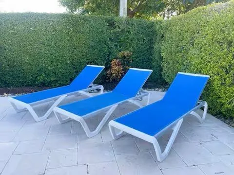 a view of a chairs and table in the patio