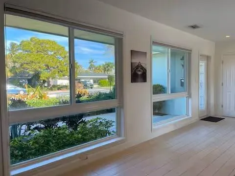 a view of front door and yard