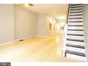 a view of a big room with wooden floor