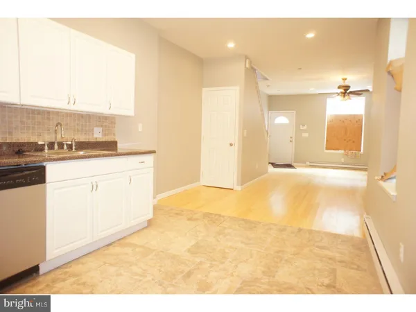 a view of a kitchen with a sink