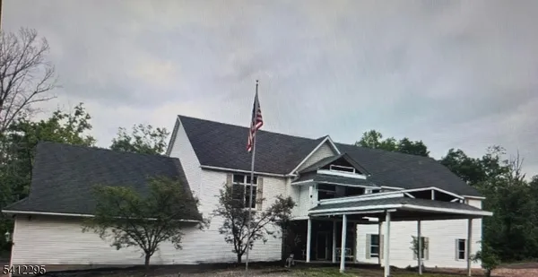 an aerial view of house with a yard