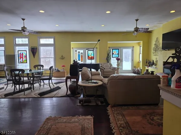 a living room with fireplace furniture and a flat screen tv