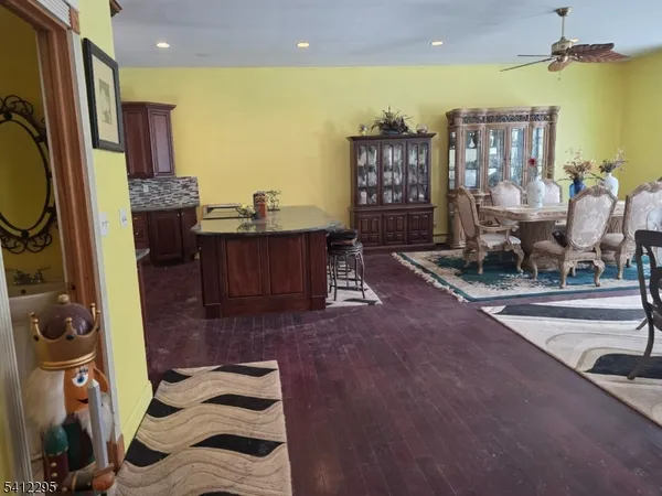 a bedroom with a bed dresser and a large mirror