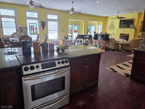 a kitchen with stainless steel appliances granite countertop a stove and a sink