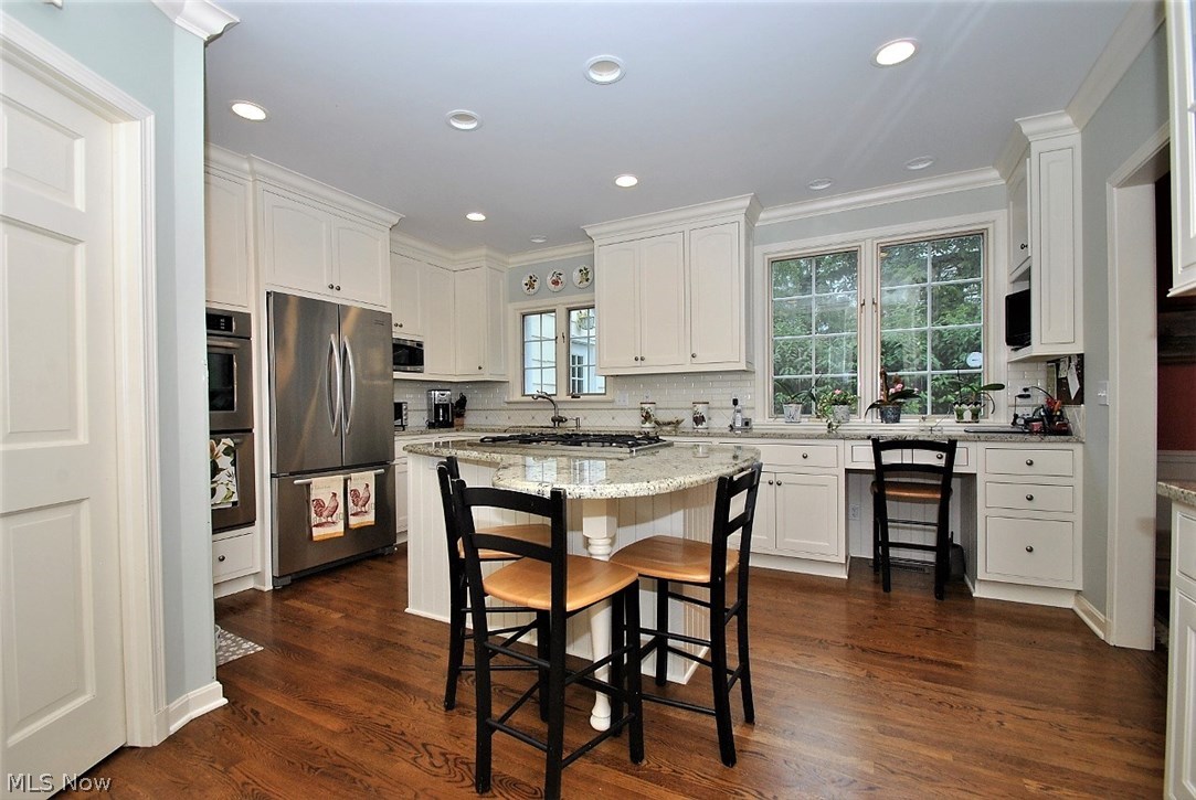 2767 Inverness Road Shaker Heights, OH 44122 - Photo 8 of 35 Gorgeous cook's kitchen has granite counters, stainless appliances, work and dining bar plus so much storage!