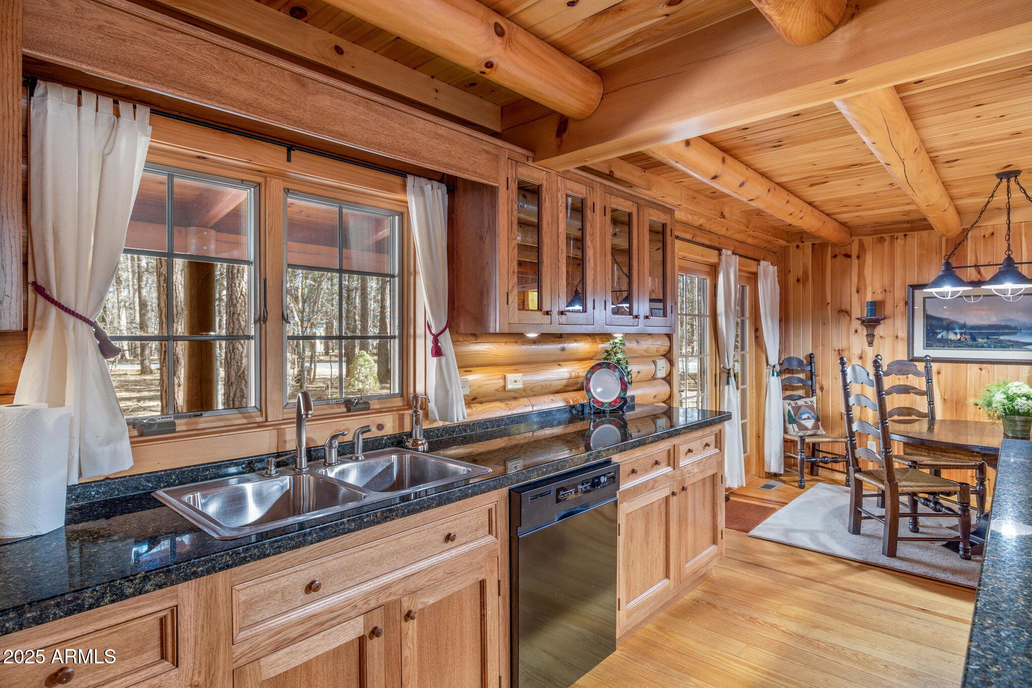 2677 Jackrabbit Drive Pinetop, AZ 85935 - Photo 8 of 87 a kitchen with stainless steel appliances granite countertop a sink and wooden cabinets