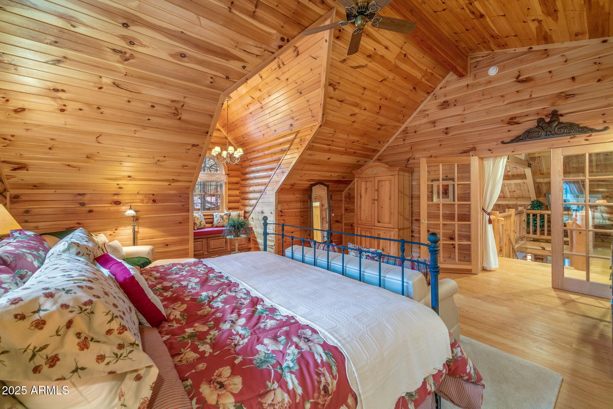 2677 Jackrabbit Drive Pinetop, AZ 85935 - Photo 15 of 87 a bed sitting in a bedroom next to a brick building