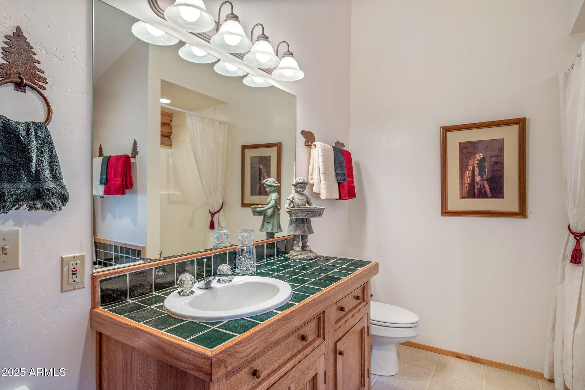 2677 Jackrabbit Drive Pinetop, AZ 85935 - Photo 19 of 87 a bathroom with a granite countertop sink a toilet and a mirror