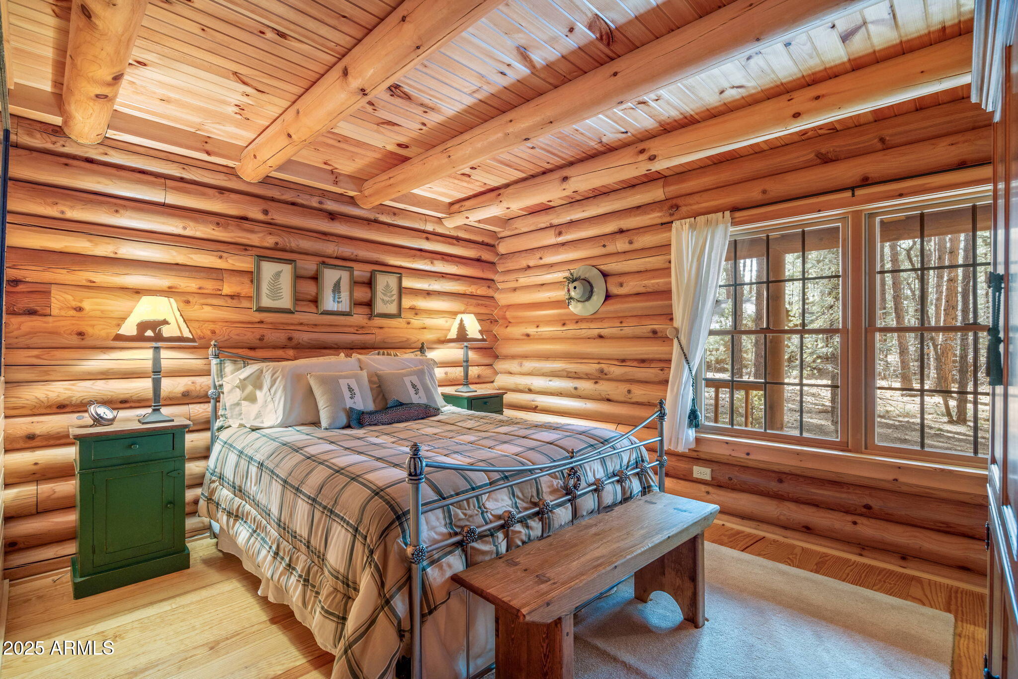 2677 Jackrabbit Drive Pinetop, AZ 85935 - Photo 22 of 87 a bedroom with a bed and a dresser next to a window