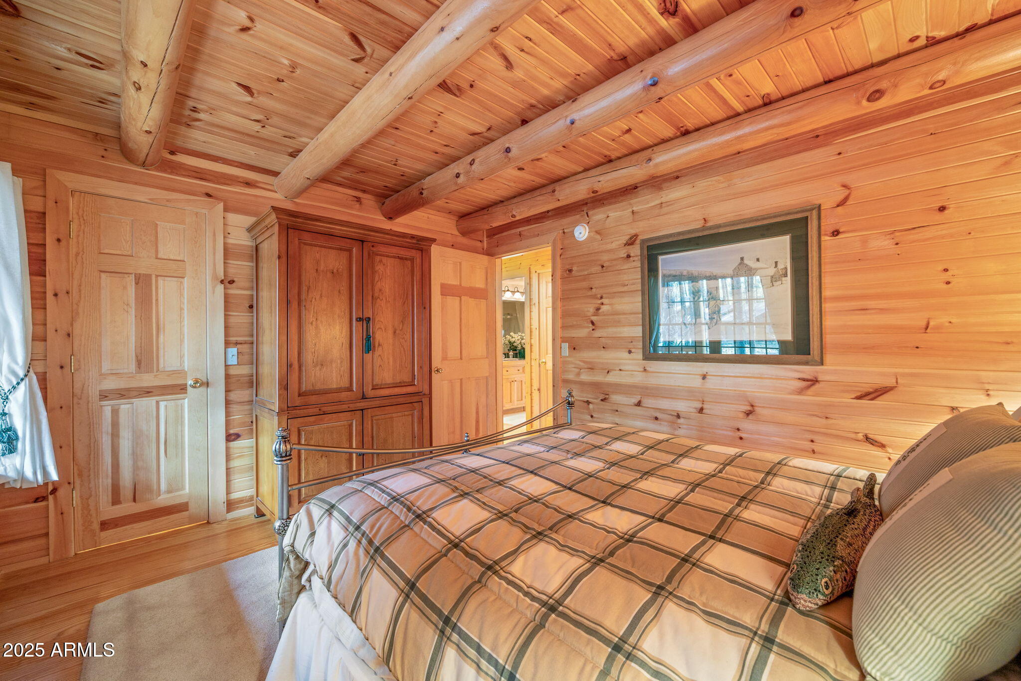 2677 Jackrabbit Drive Pinetop, AZ 85935 - Photo 23 of 87 a bedroom with a bed and a dresser