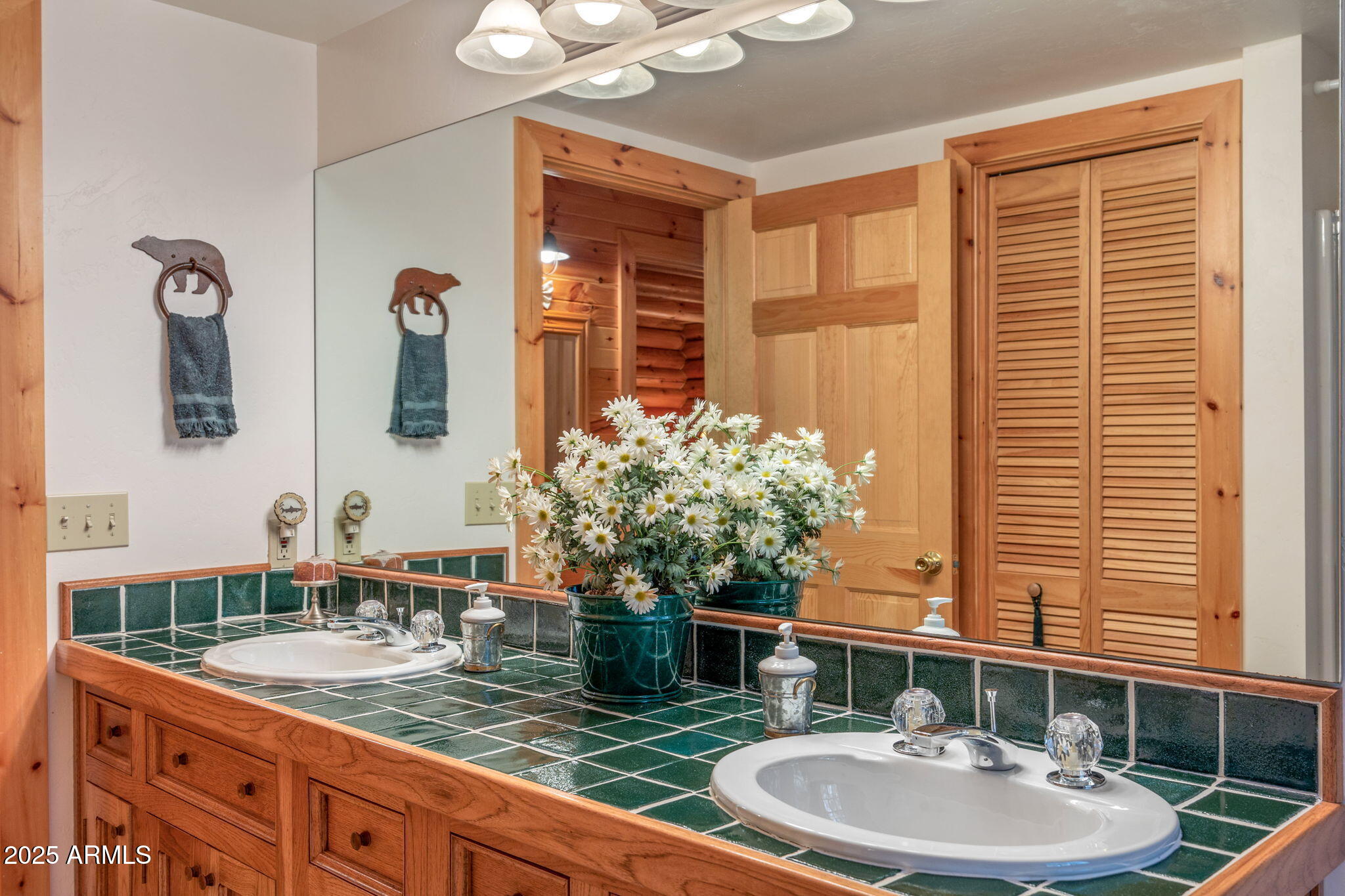 2677 Jackrabbit Drive Pinetop, AZ 85935 - Photo 25 of 87 a bathroom with a granite countertop sink a mirror and shower