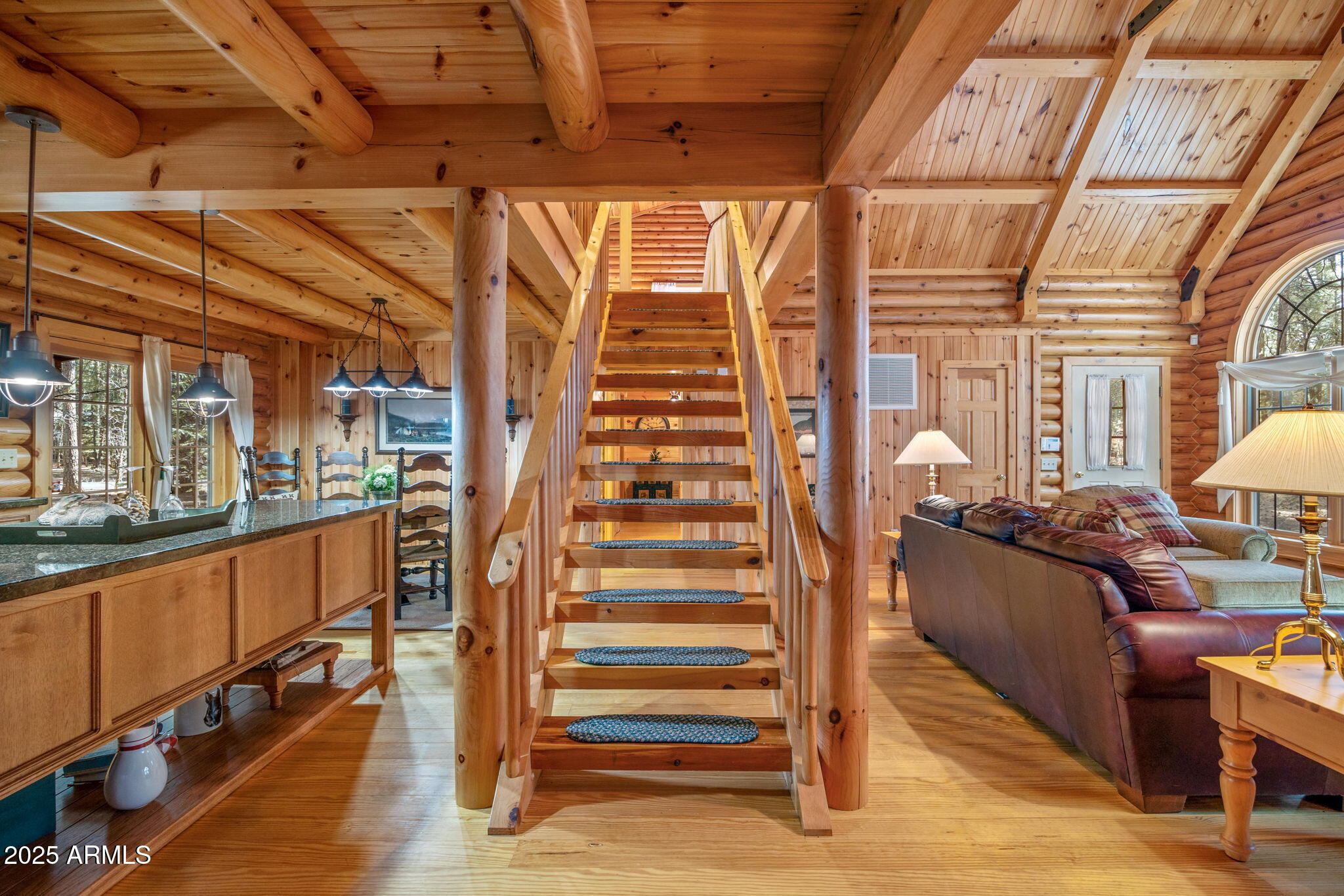 2677 Jackrabbit Drive Pinetop, AZ 85935 - Photo 28 of 87 a view of a living room with wooden floor and furniture
